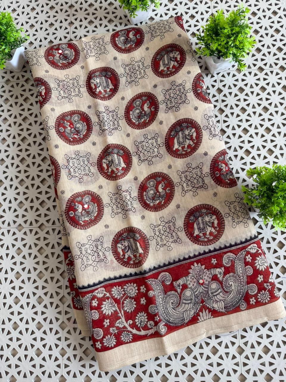 Soft linen kalamkari printed saree with aari mirror work and Taseels.